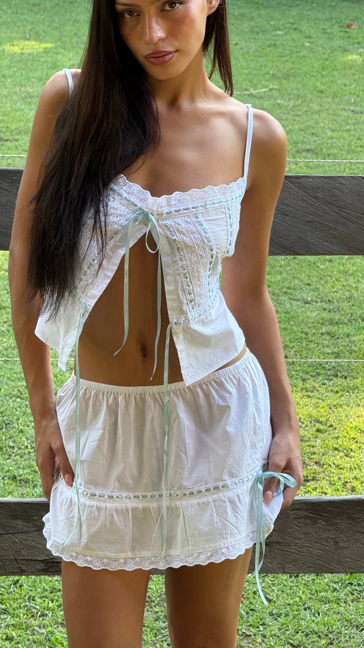 Tara & Gaia Mimi mini skirt in white - front view open top on model Aisha